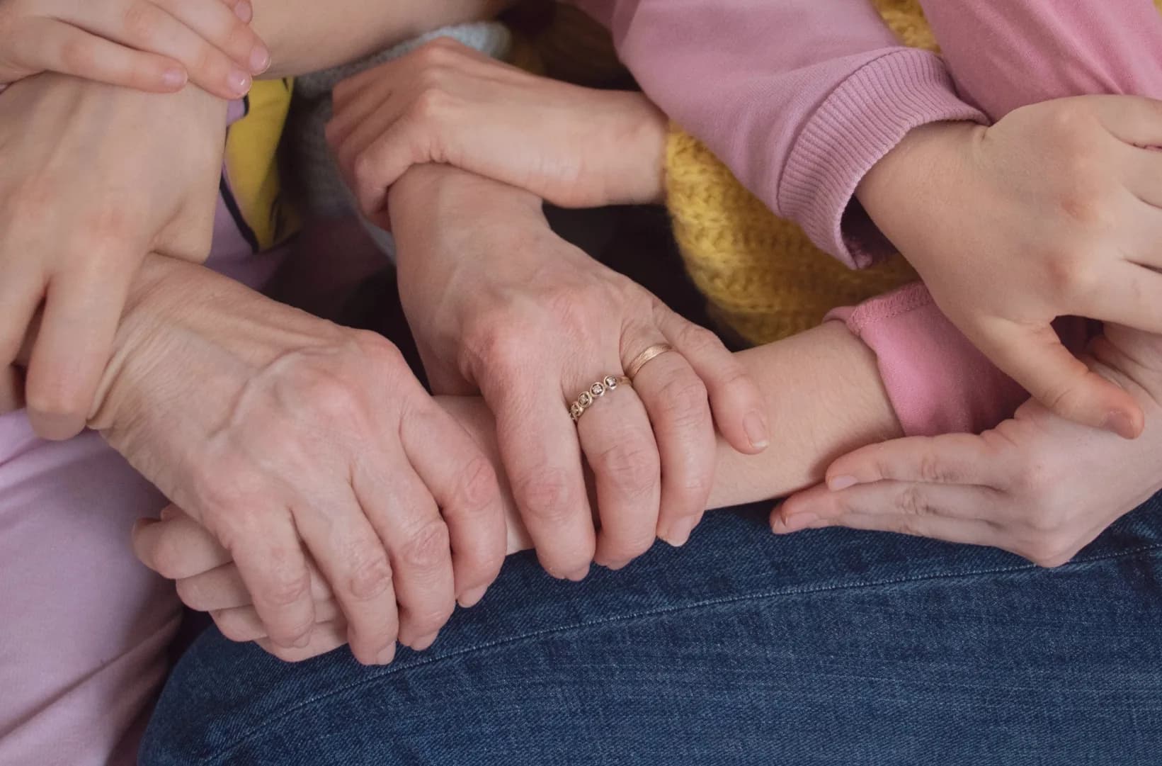 Family hands joined in support